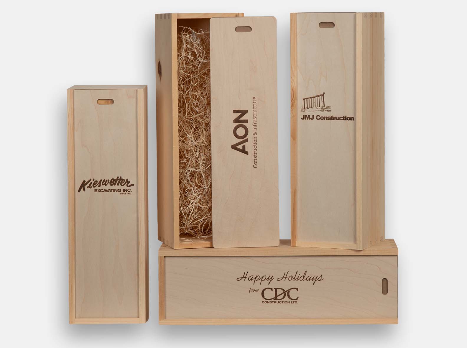 Single bottle boxes with sliding lid made from natural pine with box joint construction. Perfect for special occasions gifting in volume. Wood imprint branding and wood excelsior included.
